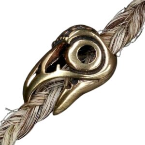 Bronzen baardkraal ravenkop